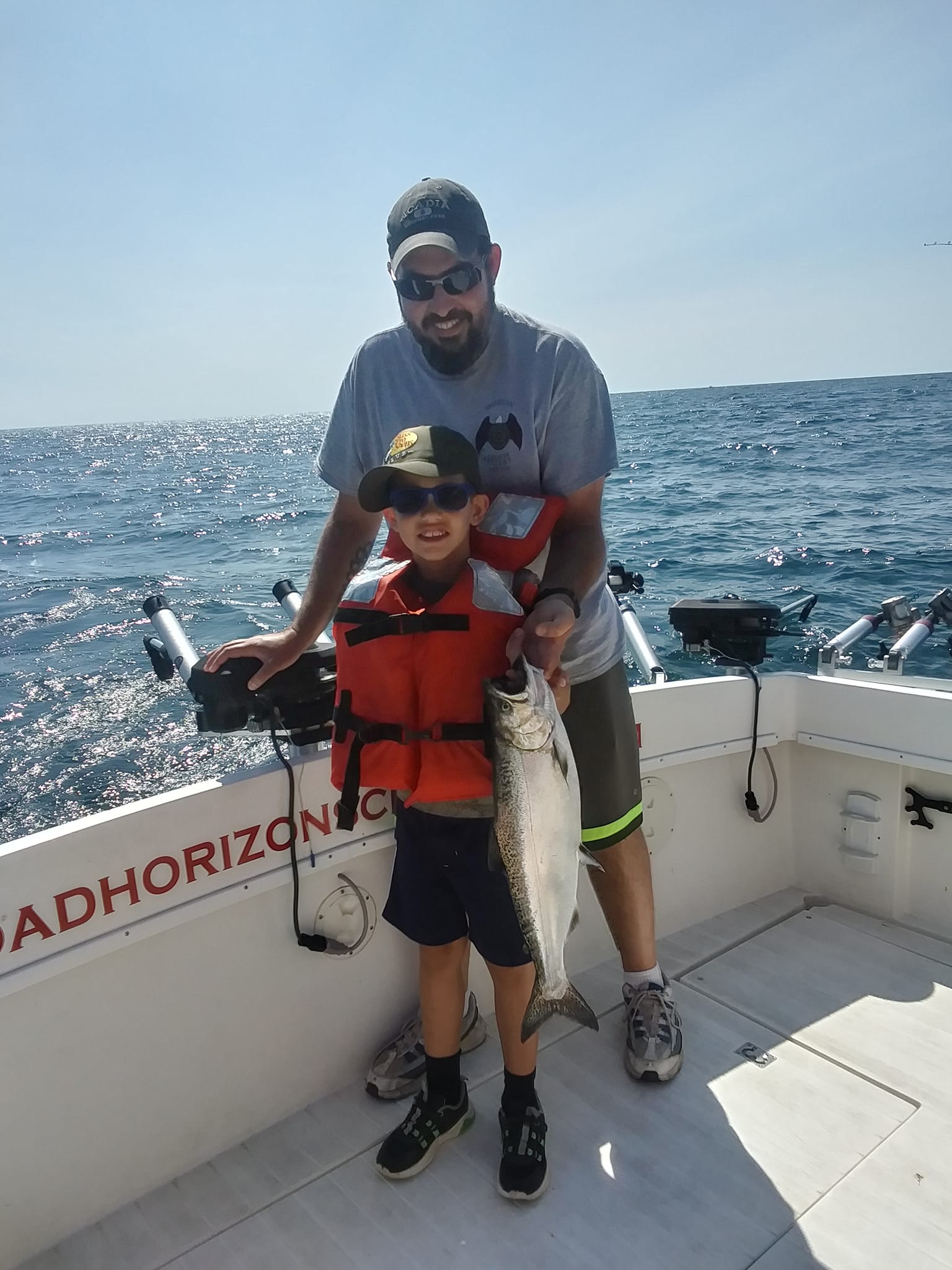 One fisherman holding a fishing rod in Oswego