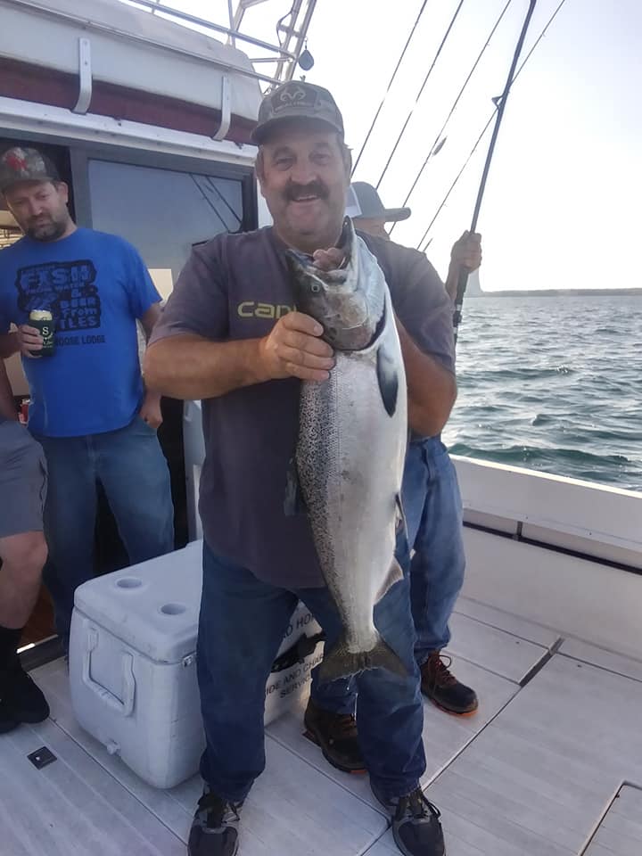 A big lake trout caught in Oswego during a fishing trip
