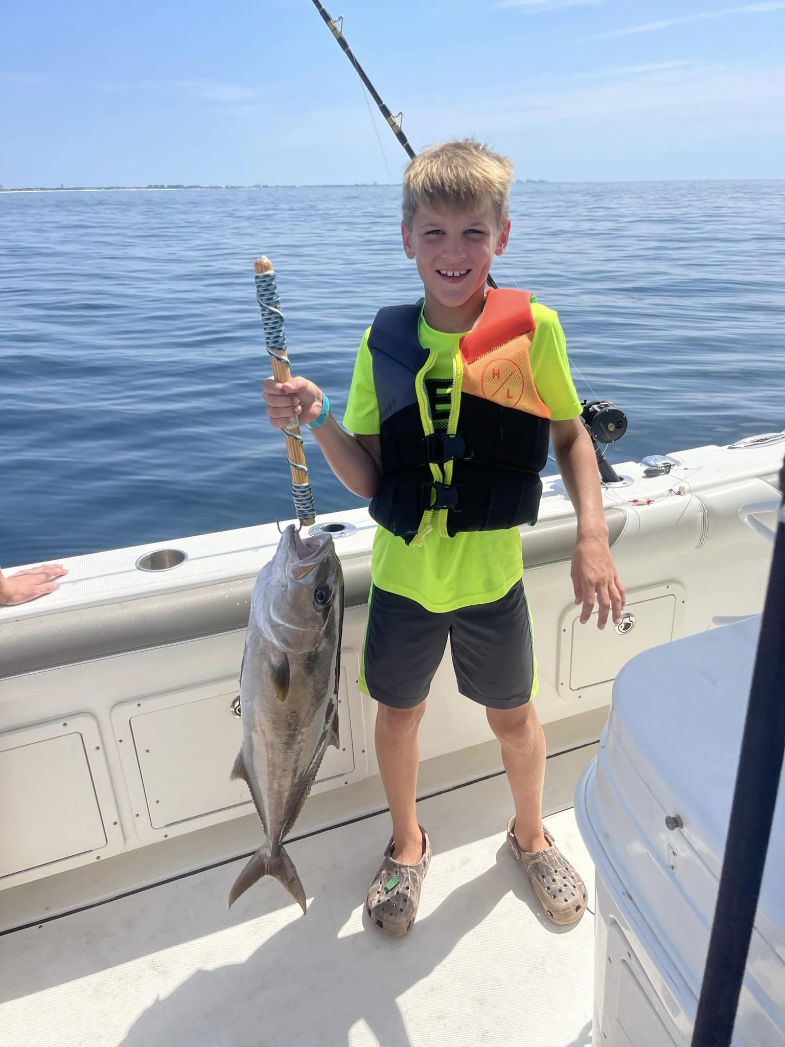A person fishing for a greater amberjack in FL