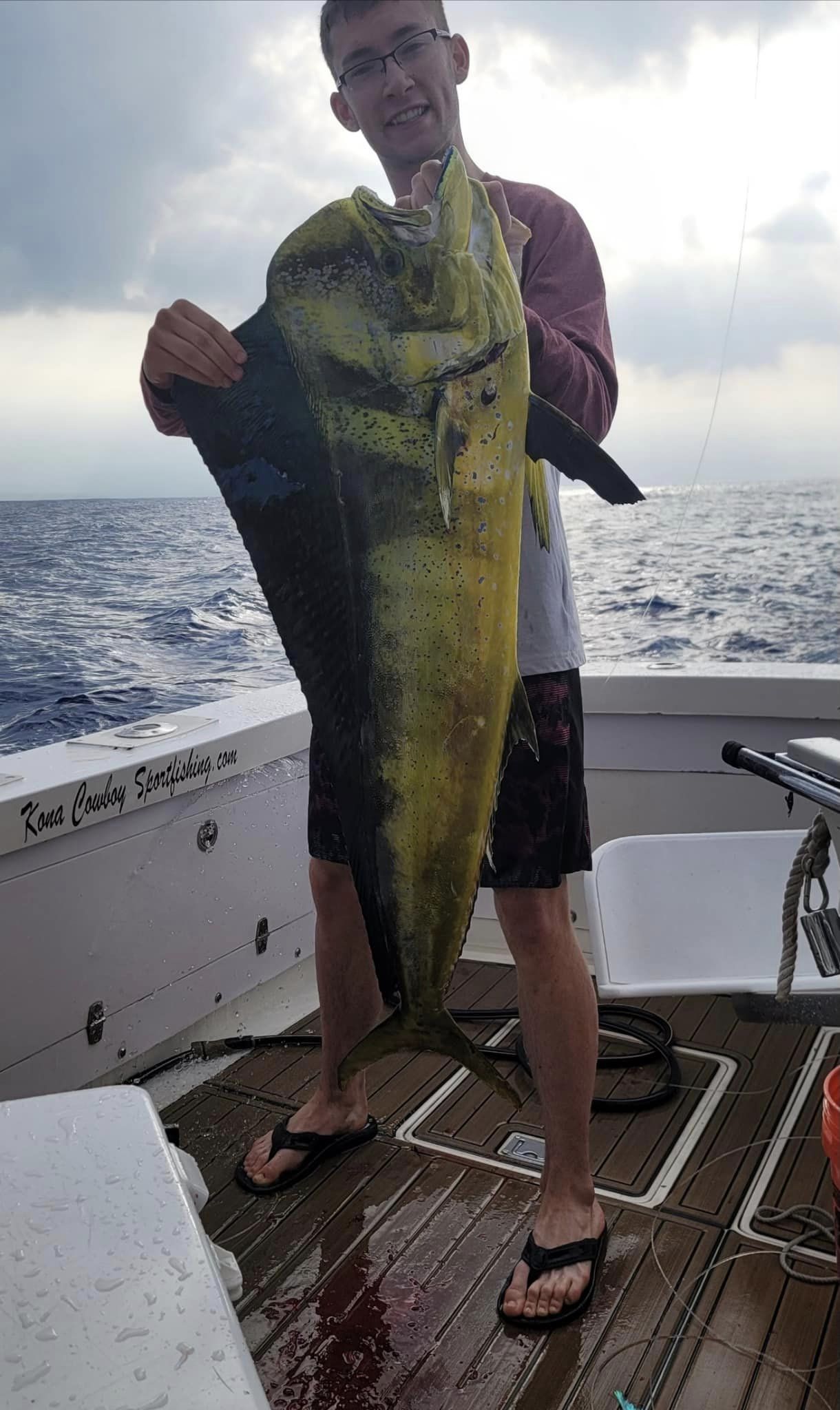 A single angler fishing in the waters of Kailua-Kona