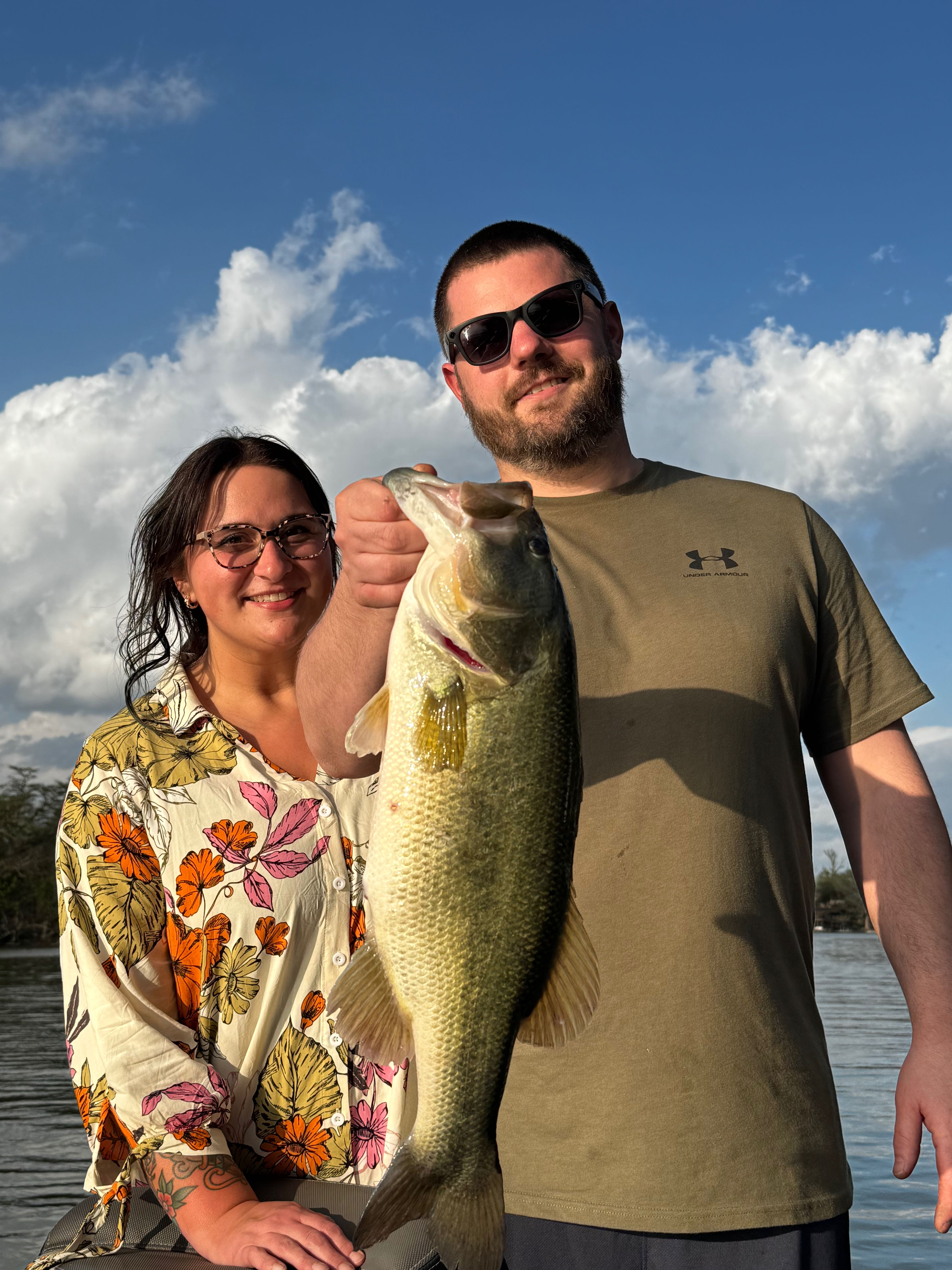 Two anglers display a large bass catch while fishing in New Braunfels TX