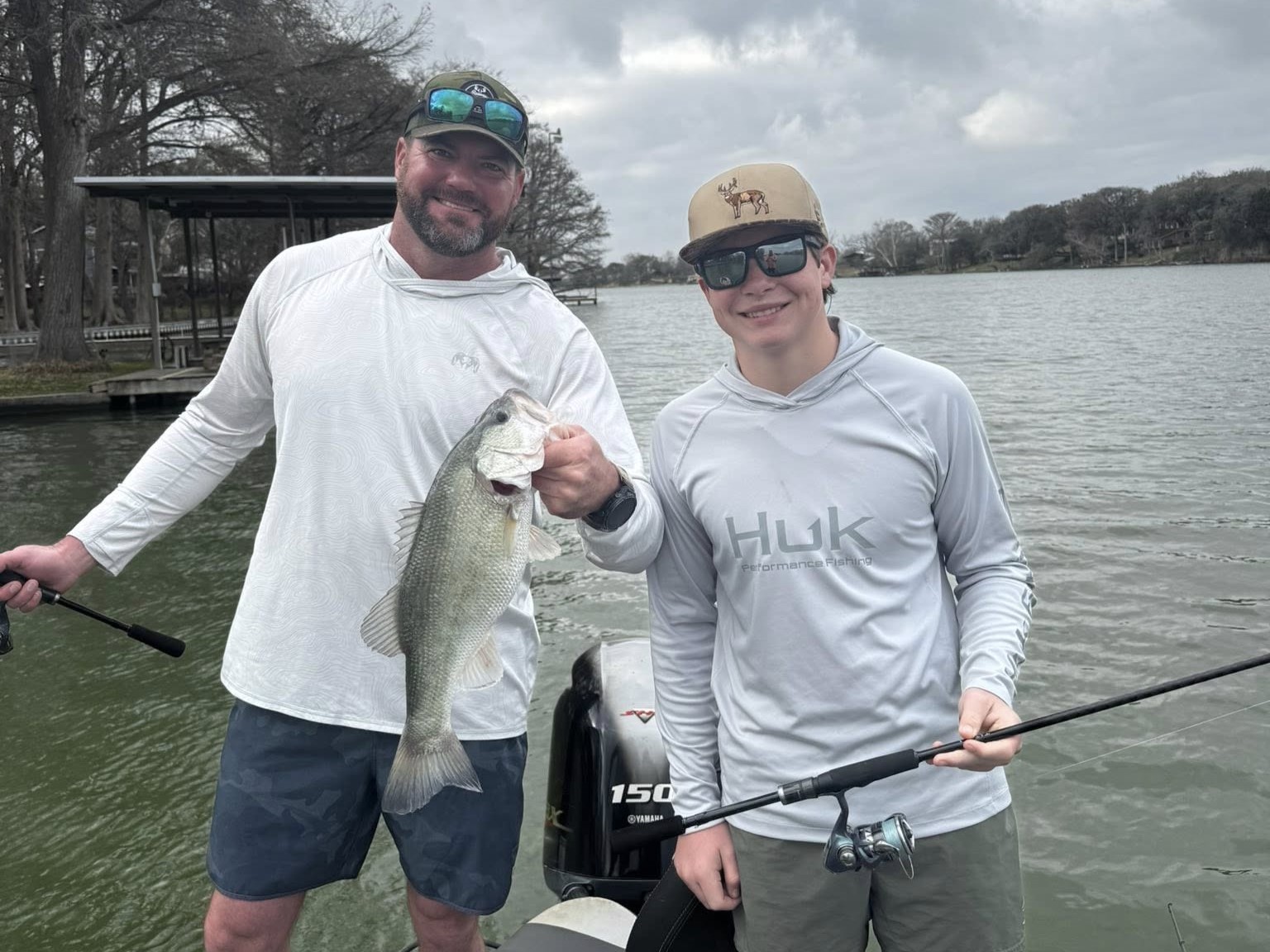 Successful fishing trip in New Braunfels TX with bass catch displayed on boat