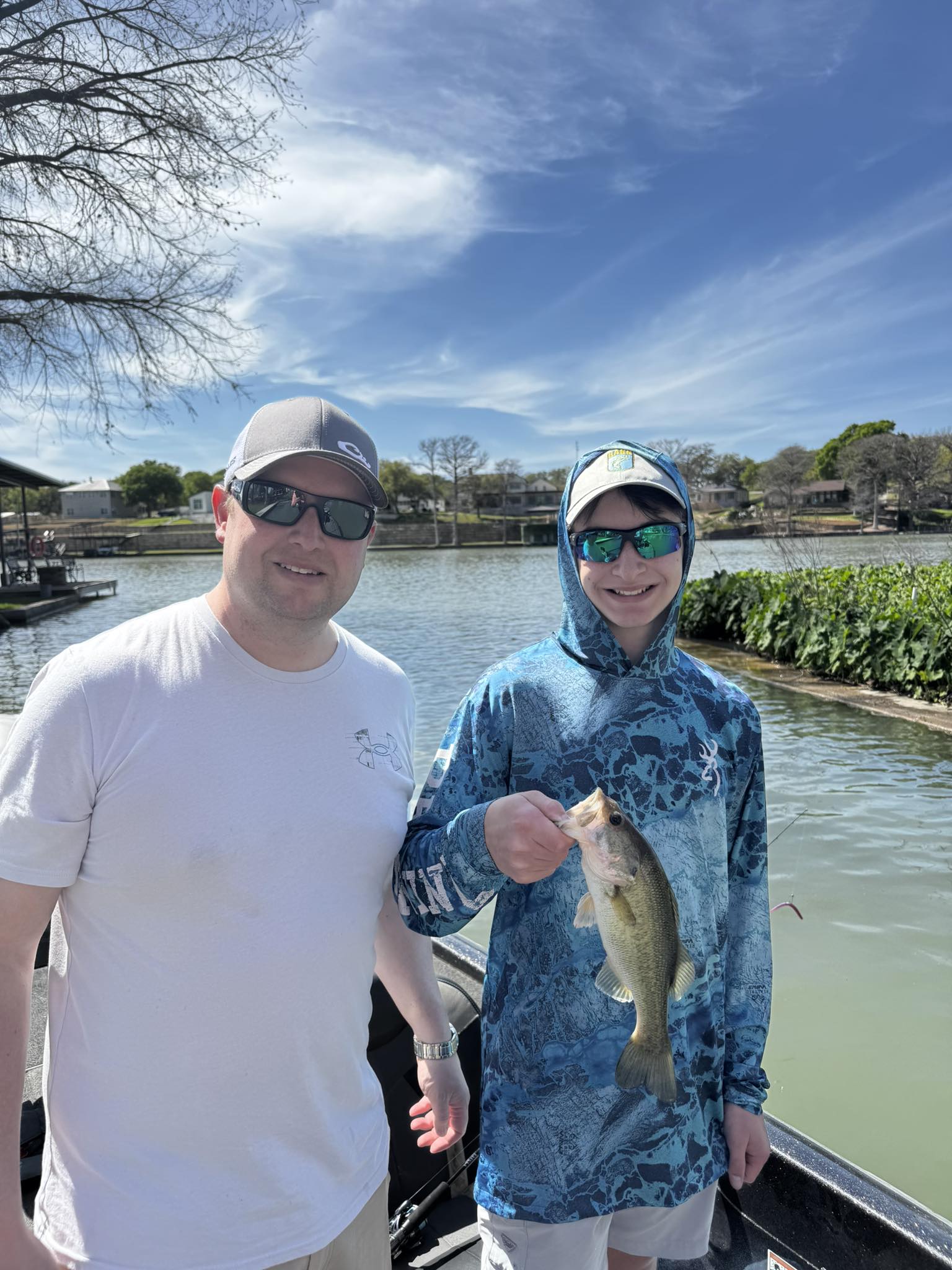 Bass fishing success in New Braunfels Texas with caught fish displayed