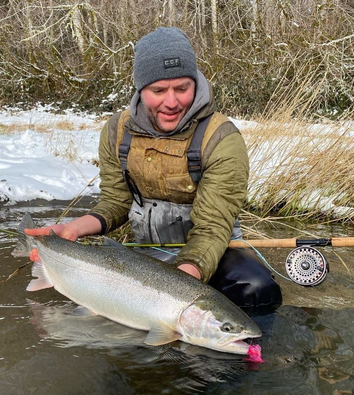 Angler with a massive lake trout in Seattle