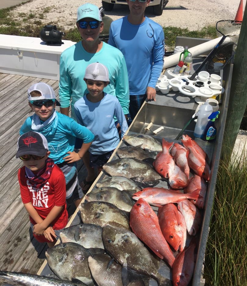 Two people fishing at Pensacola Beach