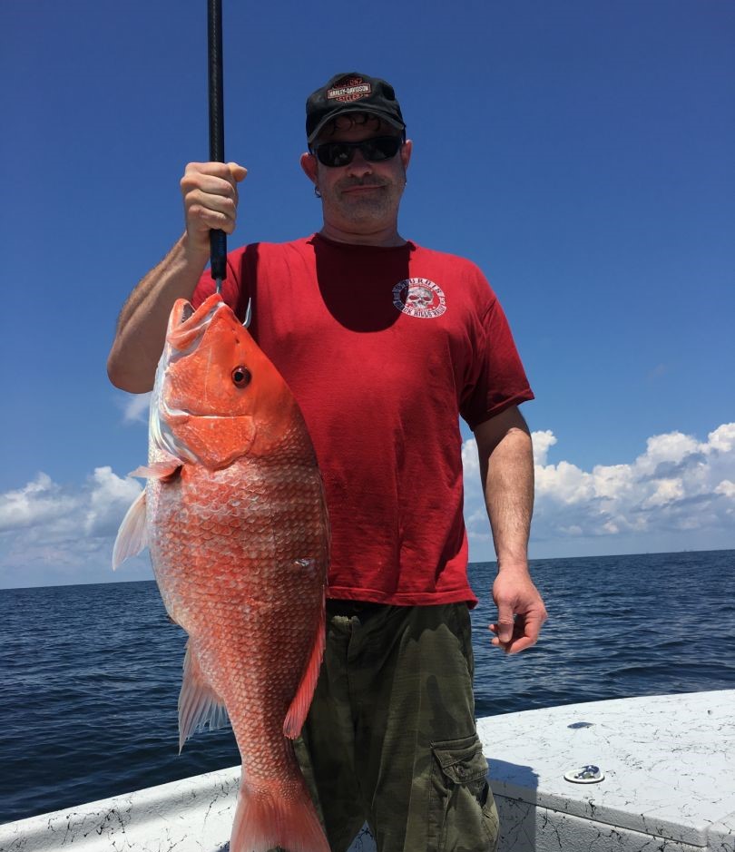 Angler with a large 27-inch fish in FL