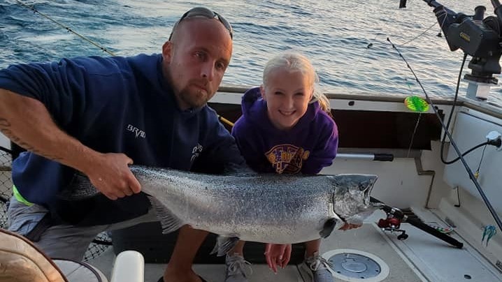 Anglers landing a fish in Wisconsin