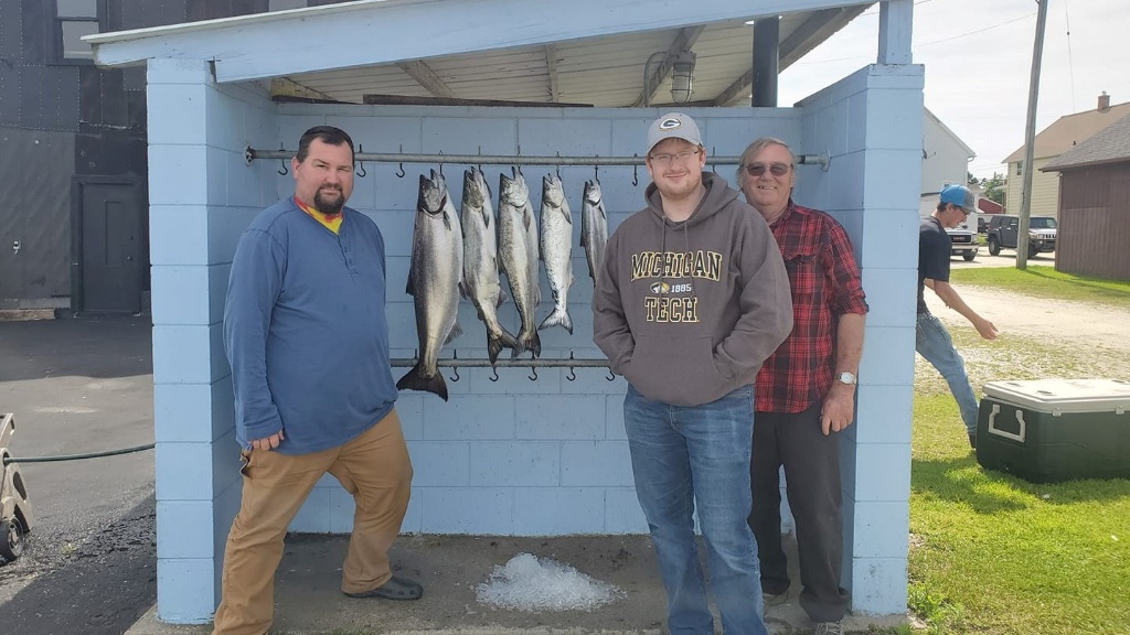 Two fishers with 2 big fish in Two Rivers