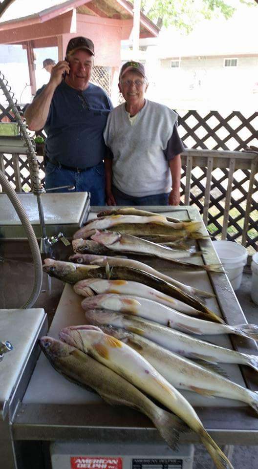 Two people fishing in MI