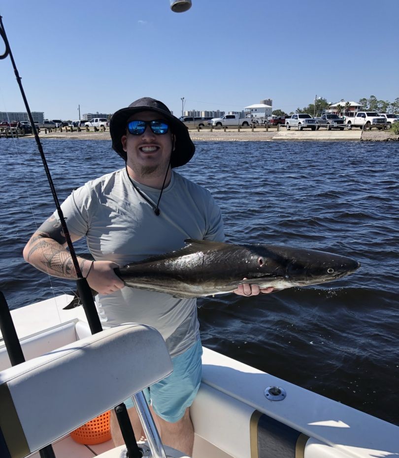 Angler posing with a 22-inch fish in AL