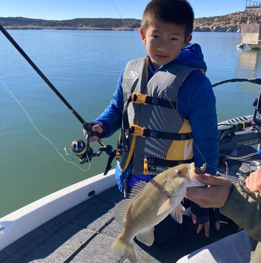 Angler with a 11-inch fish in Arboles