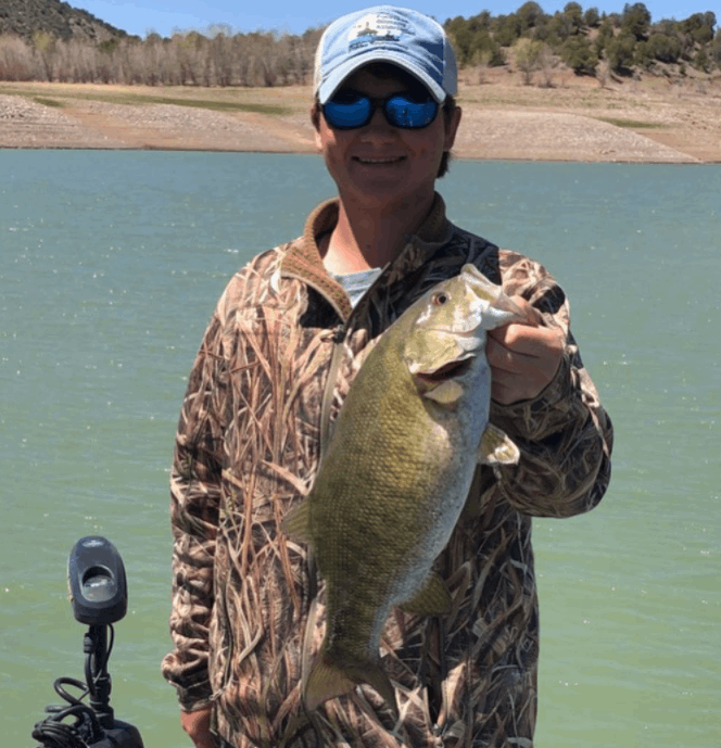 A lone fisherman casting a line in the scenic town of Arboles