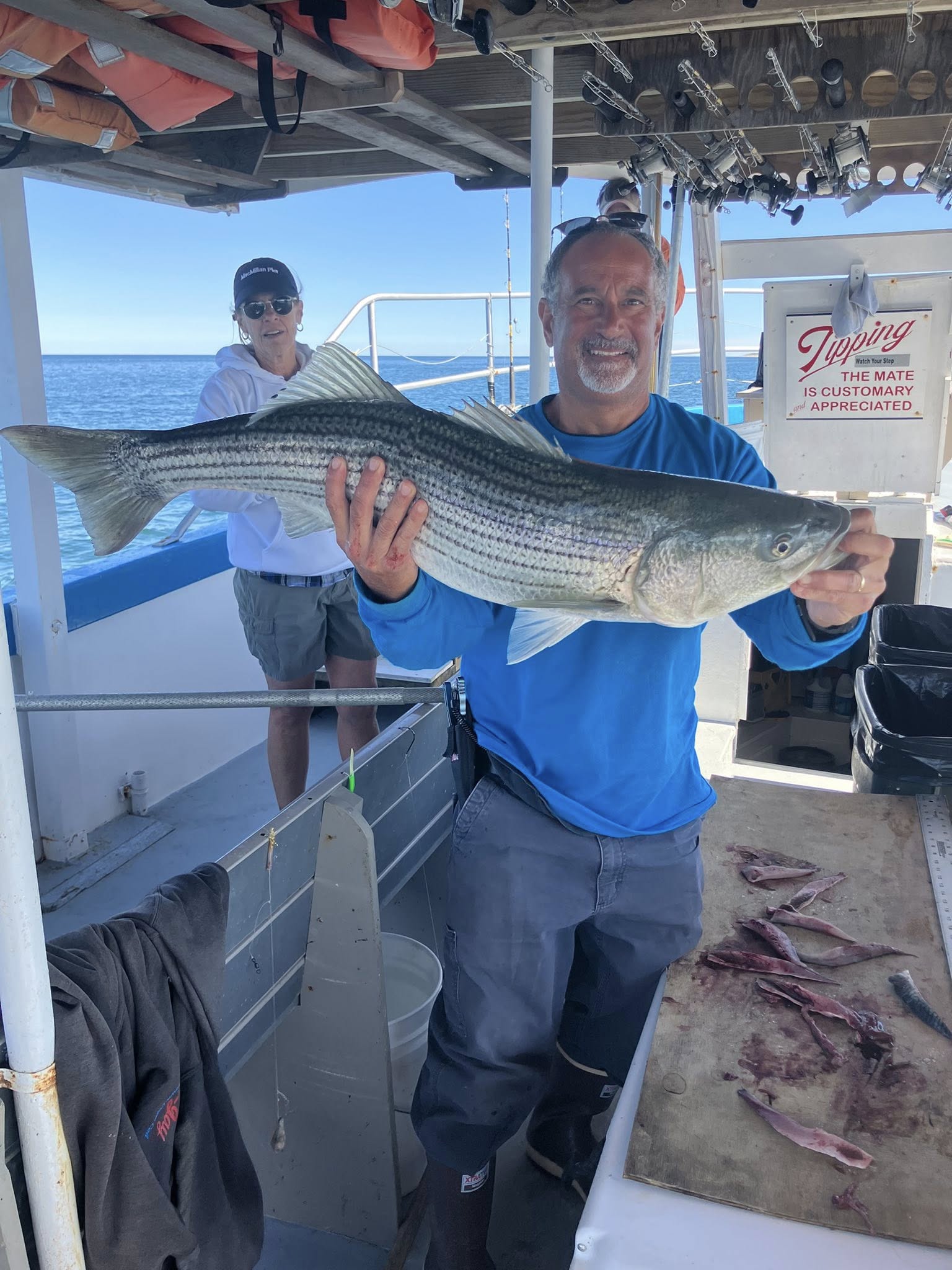 Two people fishing for striped bass in Provincetown