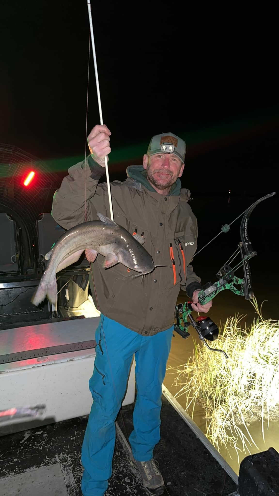 A fisherman with a blue catfish in Fannin