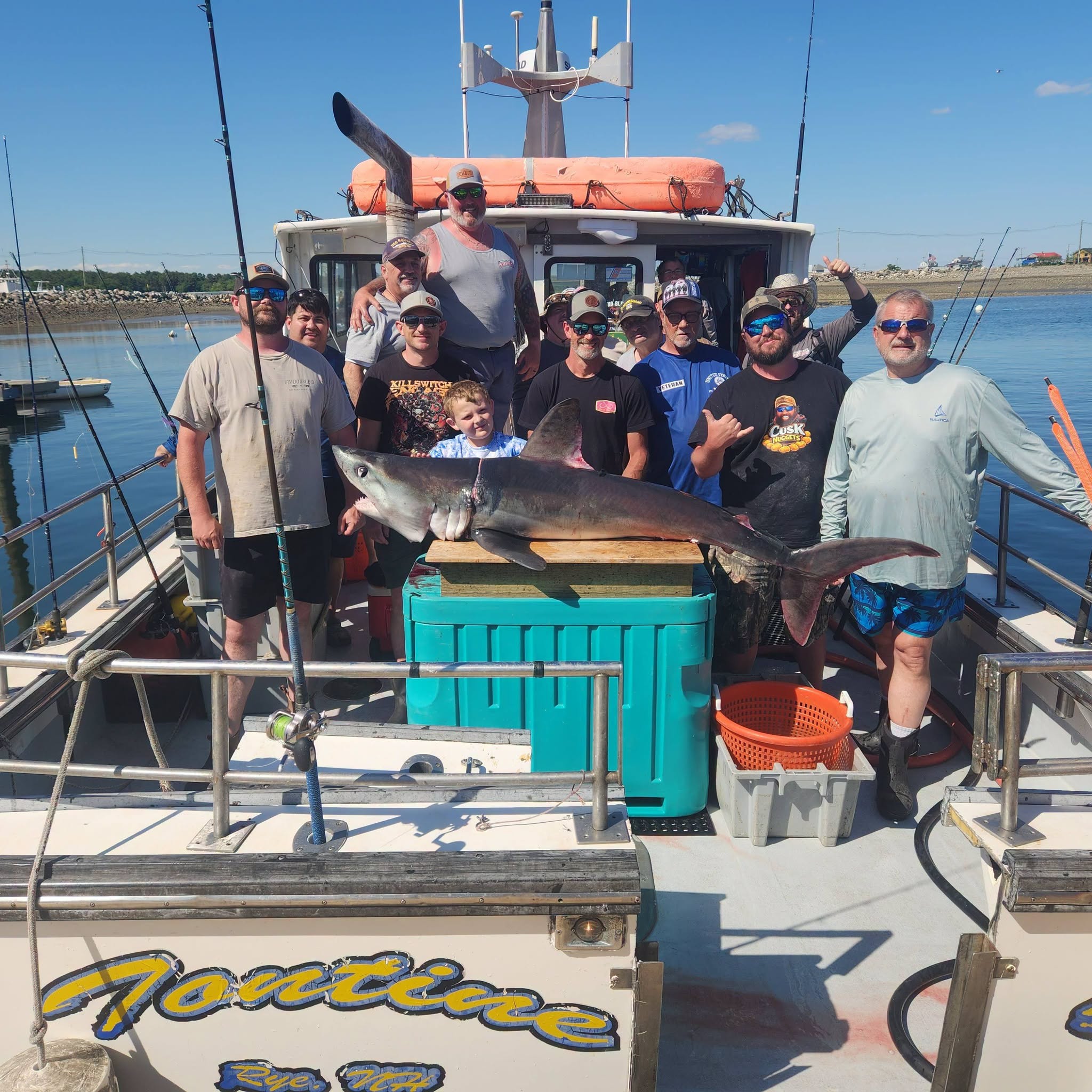 Fishing group displays large great white shark catch on charter boat in Rye NH