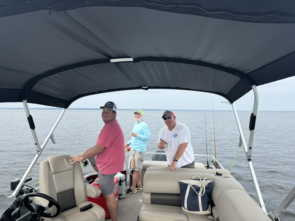 Three people fishing in TX