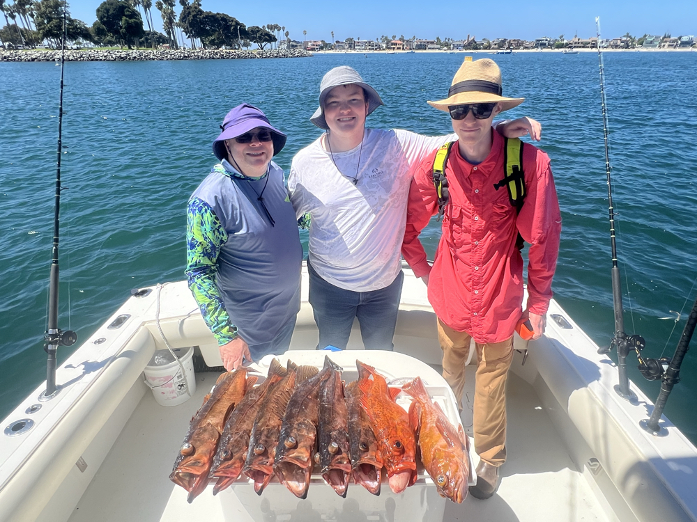 Three people fishing in San Diego
