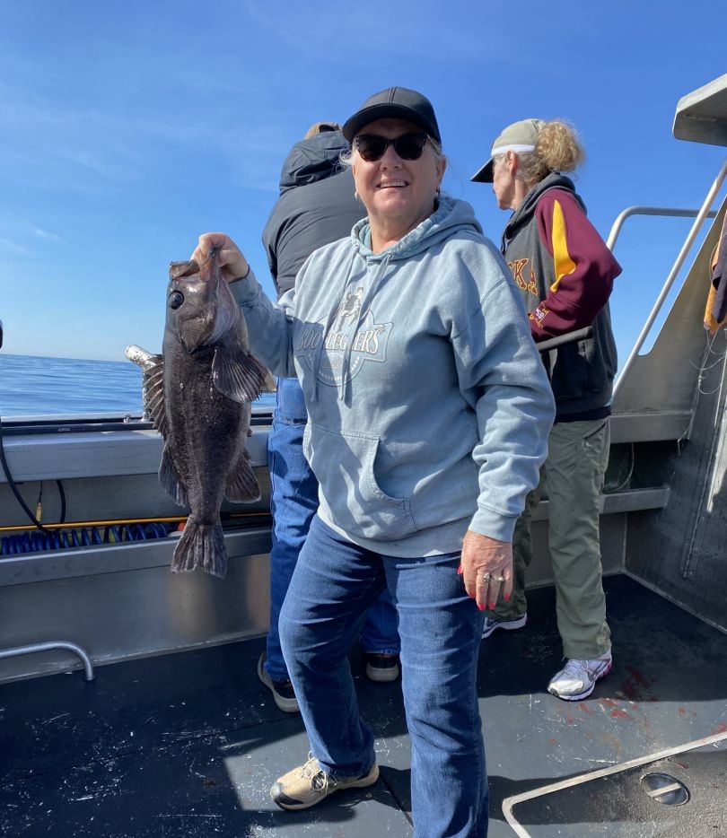 A black rockfish measuring 18 inches, caught while fishing in Alaska