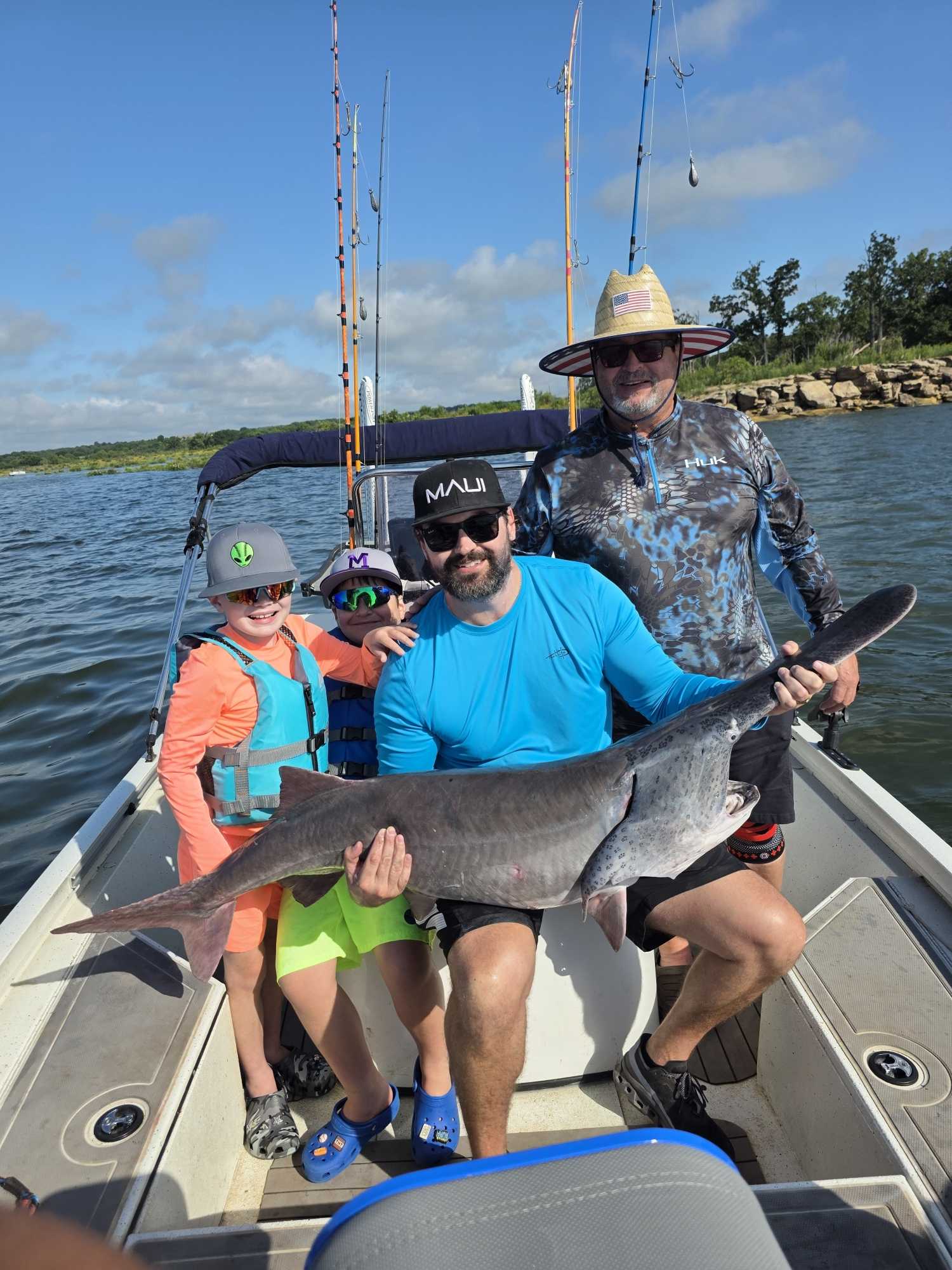 Fishing charter in Glencoe OK with large catfish catch on boat