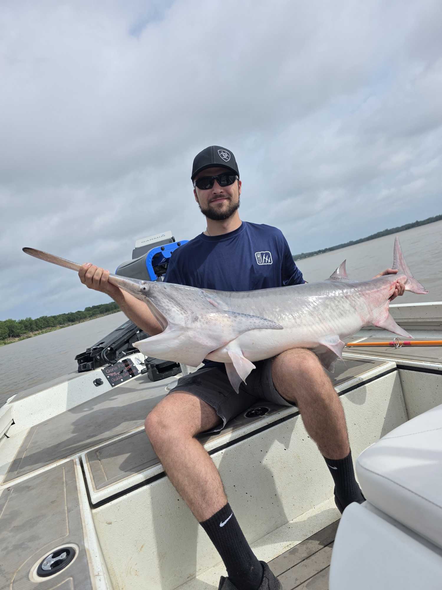 Large catfish caught during fishing tour in Glencoe OK displayed on boat deck