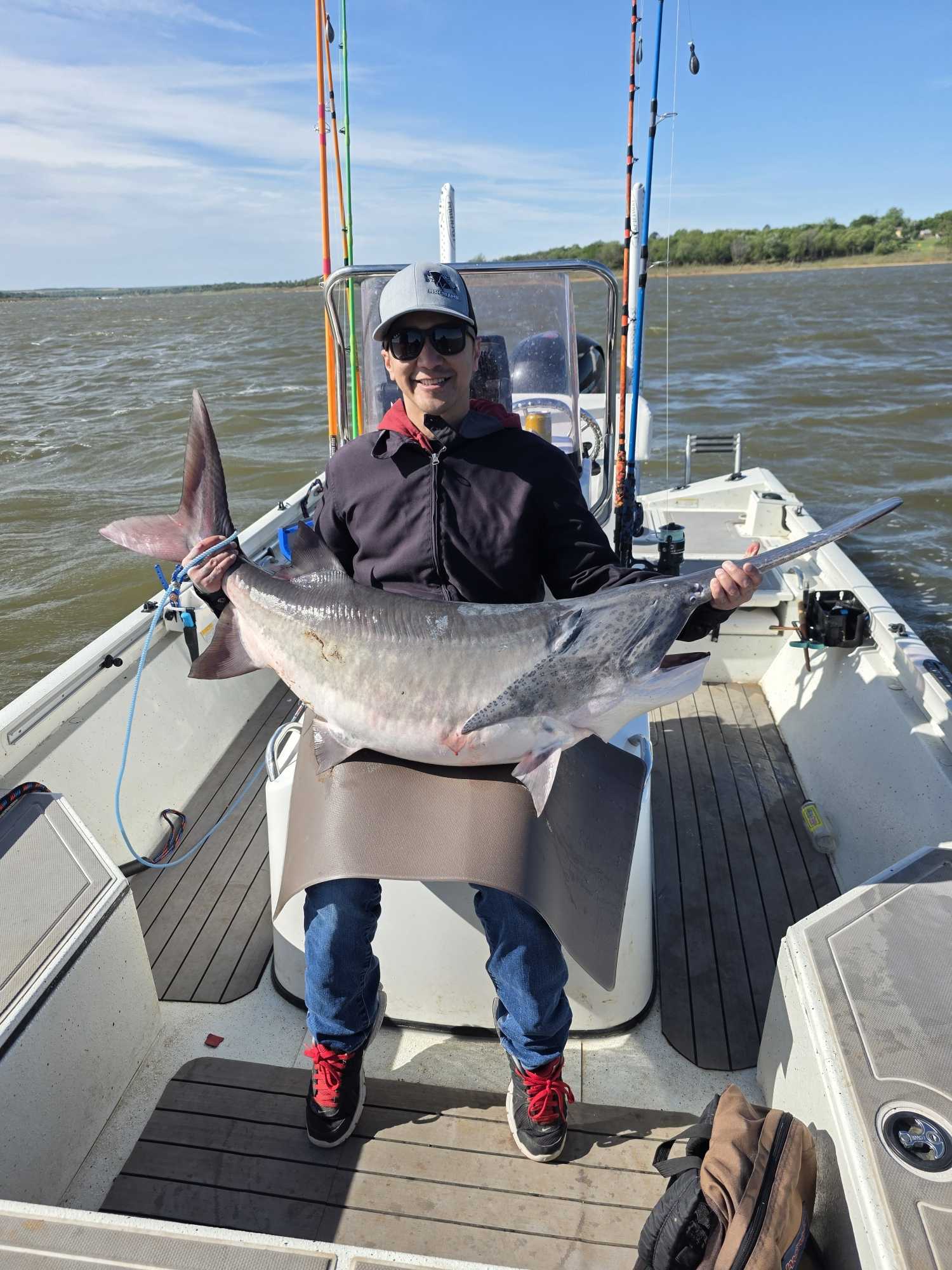 Large fish caught during fishing trip in Glencoe OK displayed on boat deck