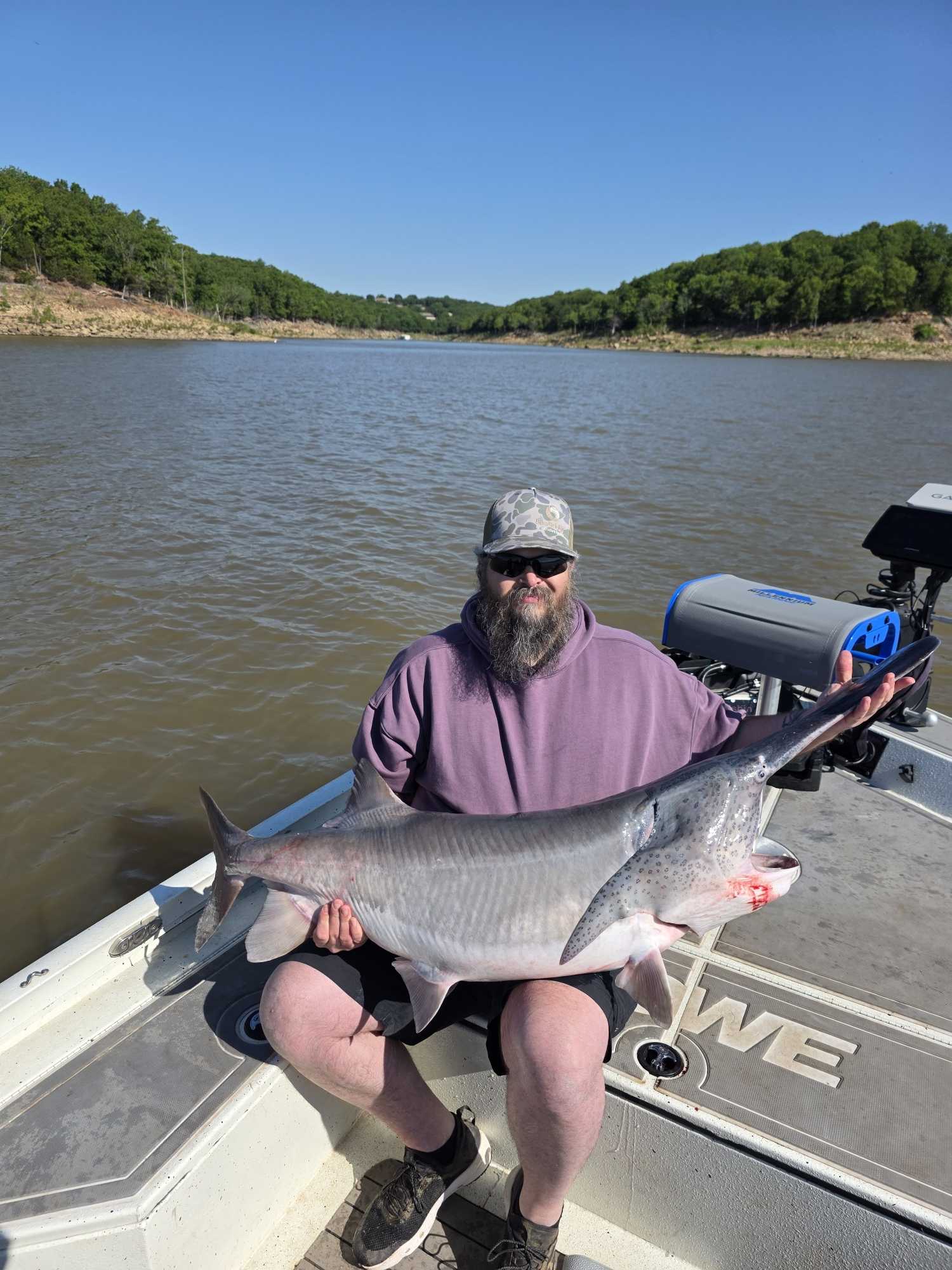 Large spoonbill catfish catch displayed on fishing boat at Glencoe OK lake