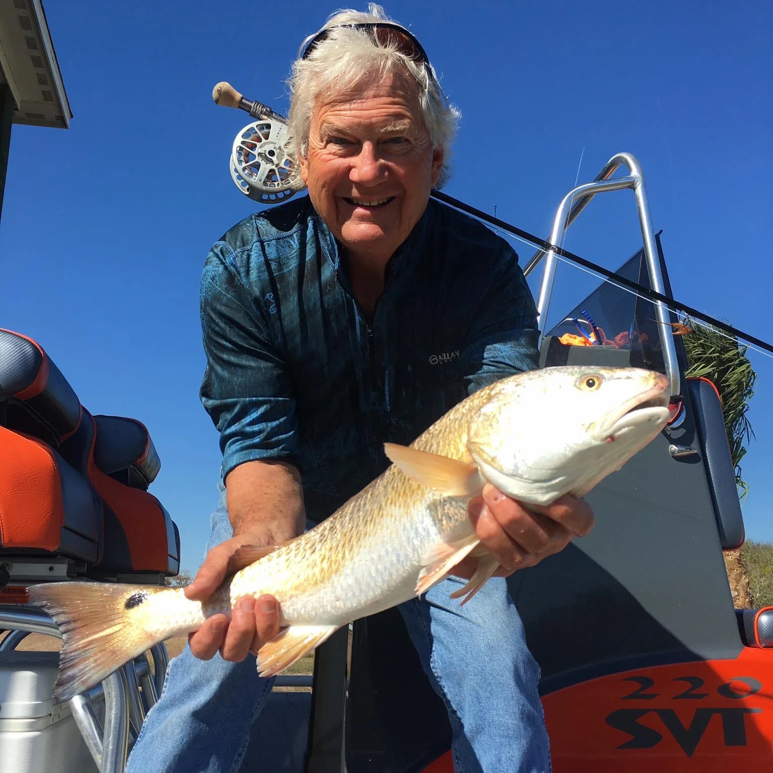 Angler holding a 23-inch fish in Matagorda