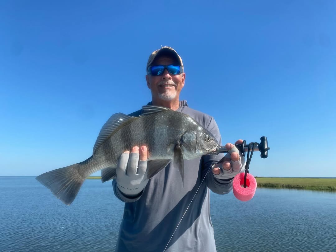 Fisherman with a large black drum fish in Matagorda