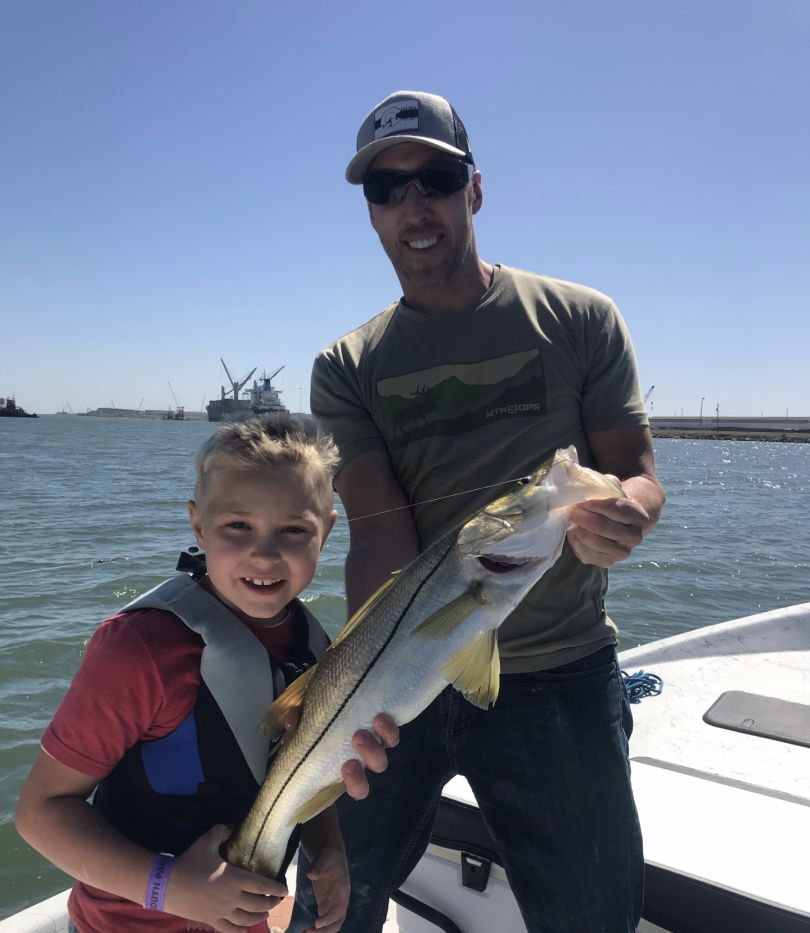A pair of anglers enjoying a fishing trip in Port Isabel