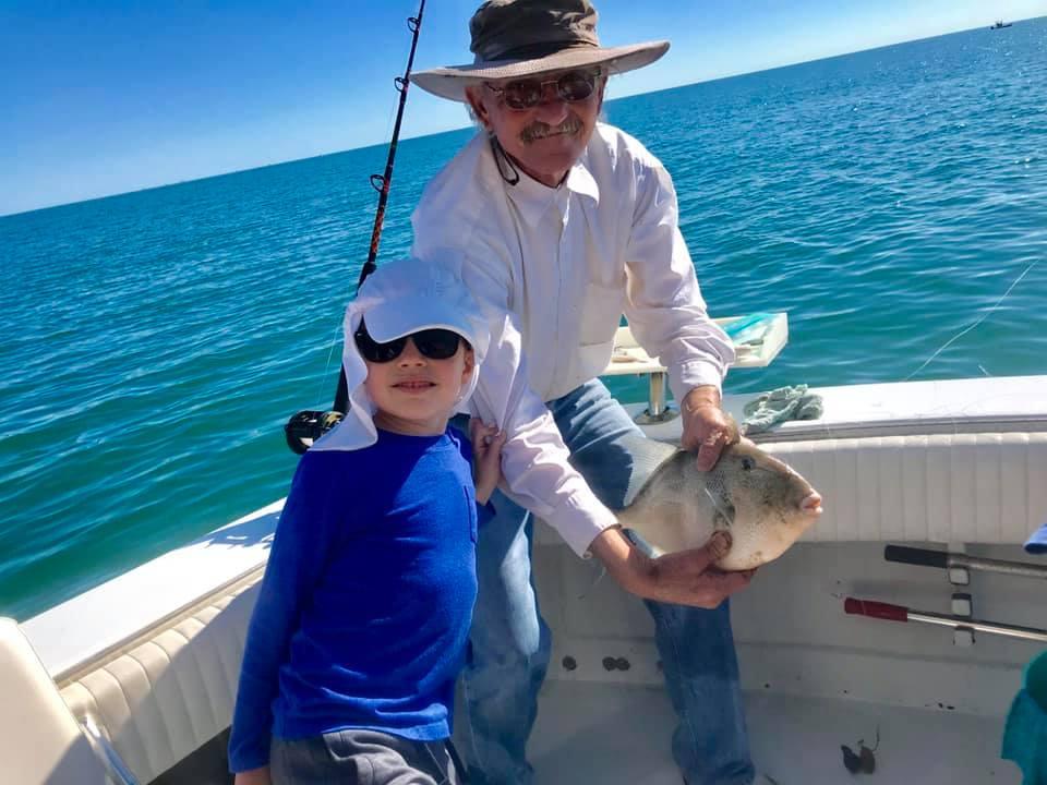Two anglers with a fishing rod and tackle in Port Isabel