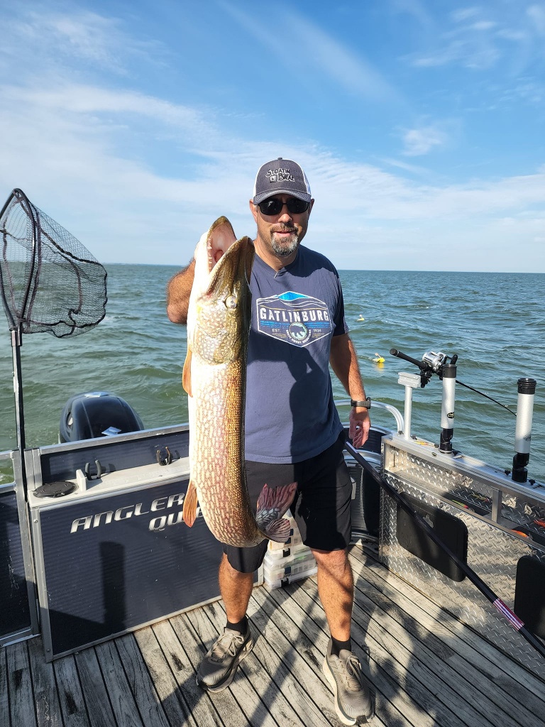 Angler with a 26-inch fish in MI