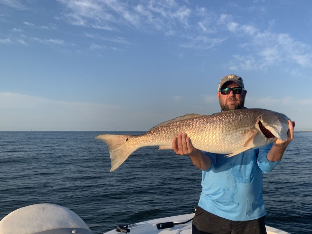 Angler catches a big fish in Golden Meadow