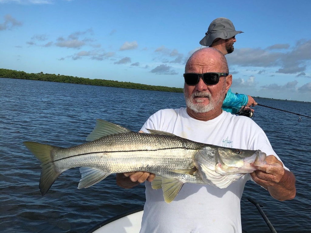 Snook fish caught by two people in Florida