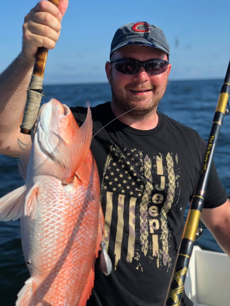Angler with catch at Surfside Beach