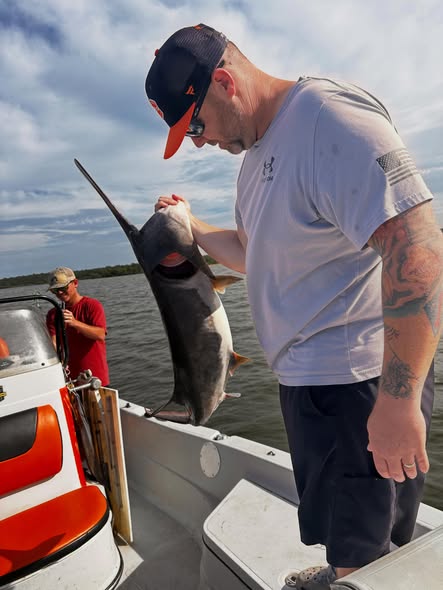 Large fish being held on boat deck in Wagoner OK fishing trip
