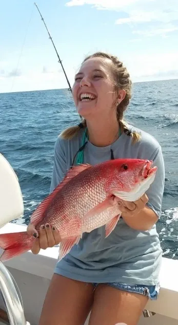 Fisherman reeling in catch in North Carolina