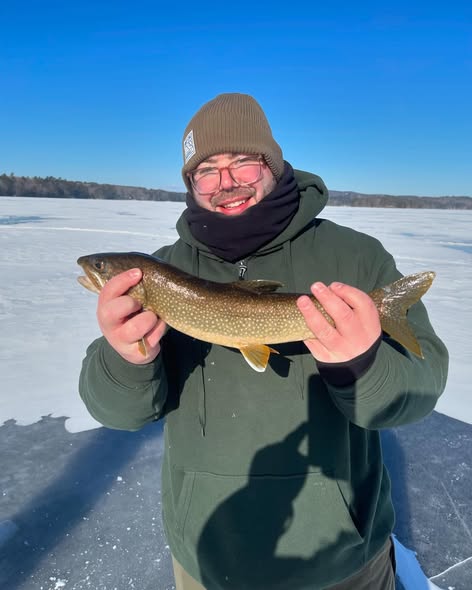 Lake trout caught ice fishing in Poland, Maine on frozen lake