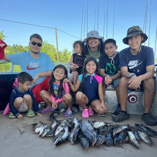Group of 8 people fishing in TX
