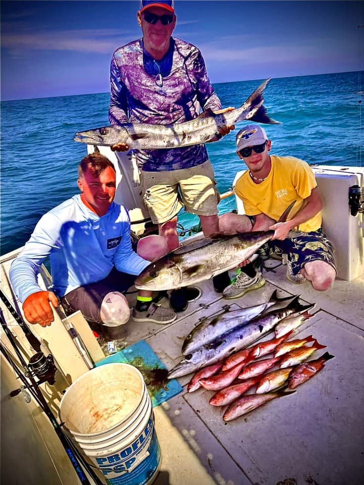 3 people fishing with 2 big fish in Port Orange