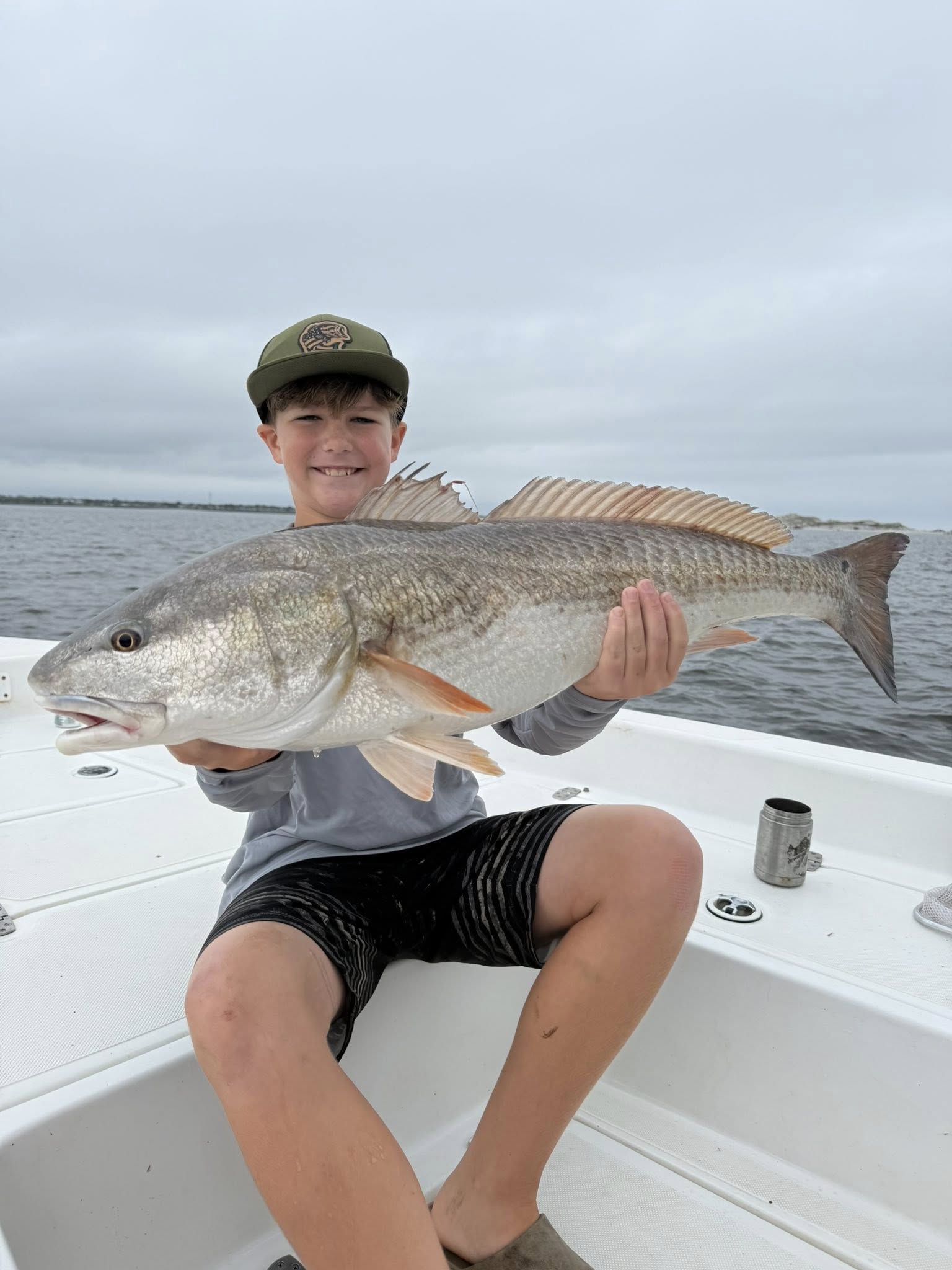 Large redfish caught while fishing in Jacksonville FL on boat deck