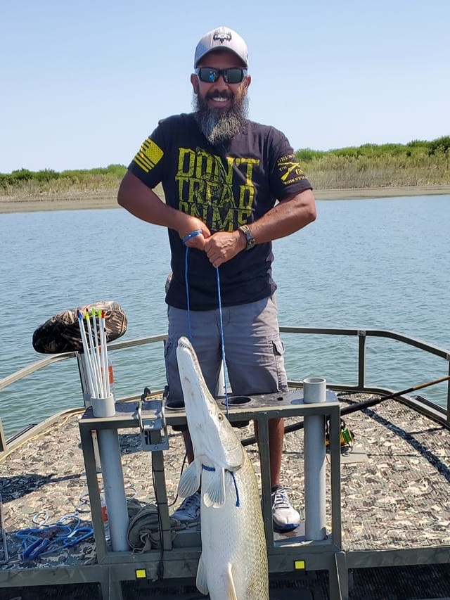 Angler holding a 24-inch fish in TX