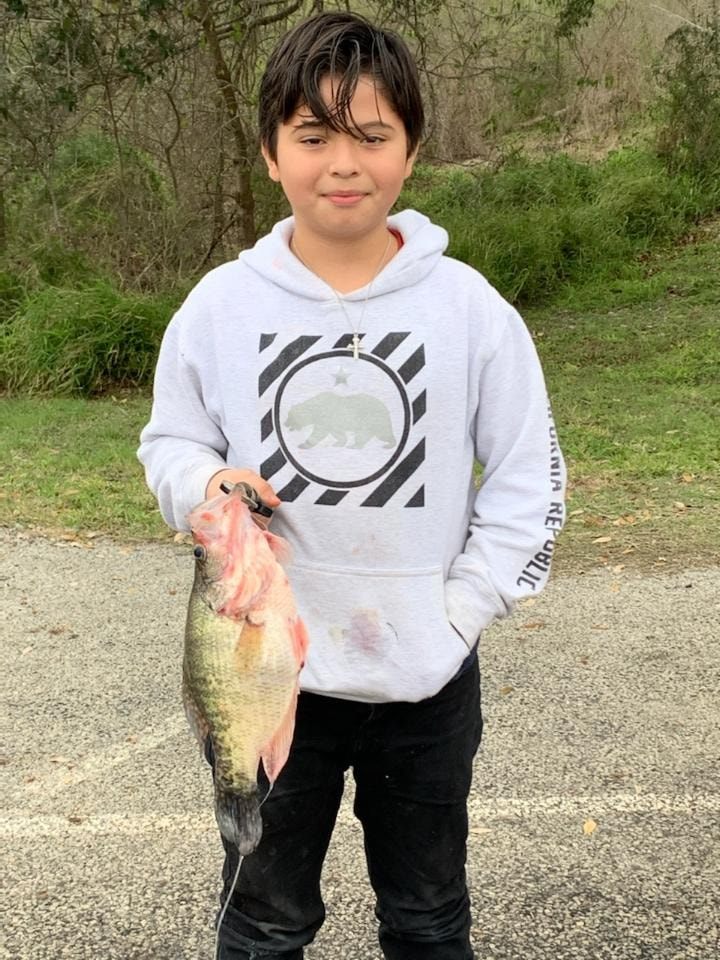 Lone angler reeling in a catch in TX