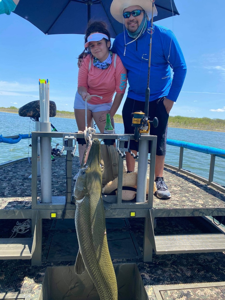 Two anglers with a large fish caught in TX