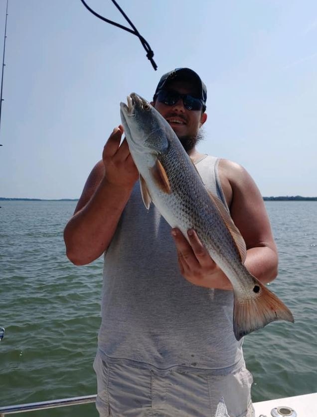 Angler holding a 22-inch fish in SC
