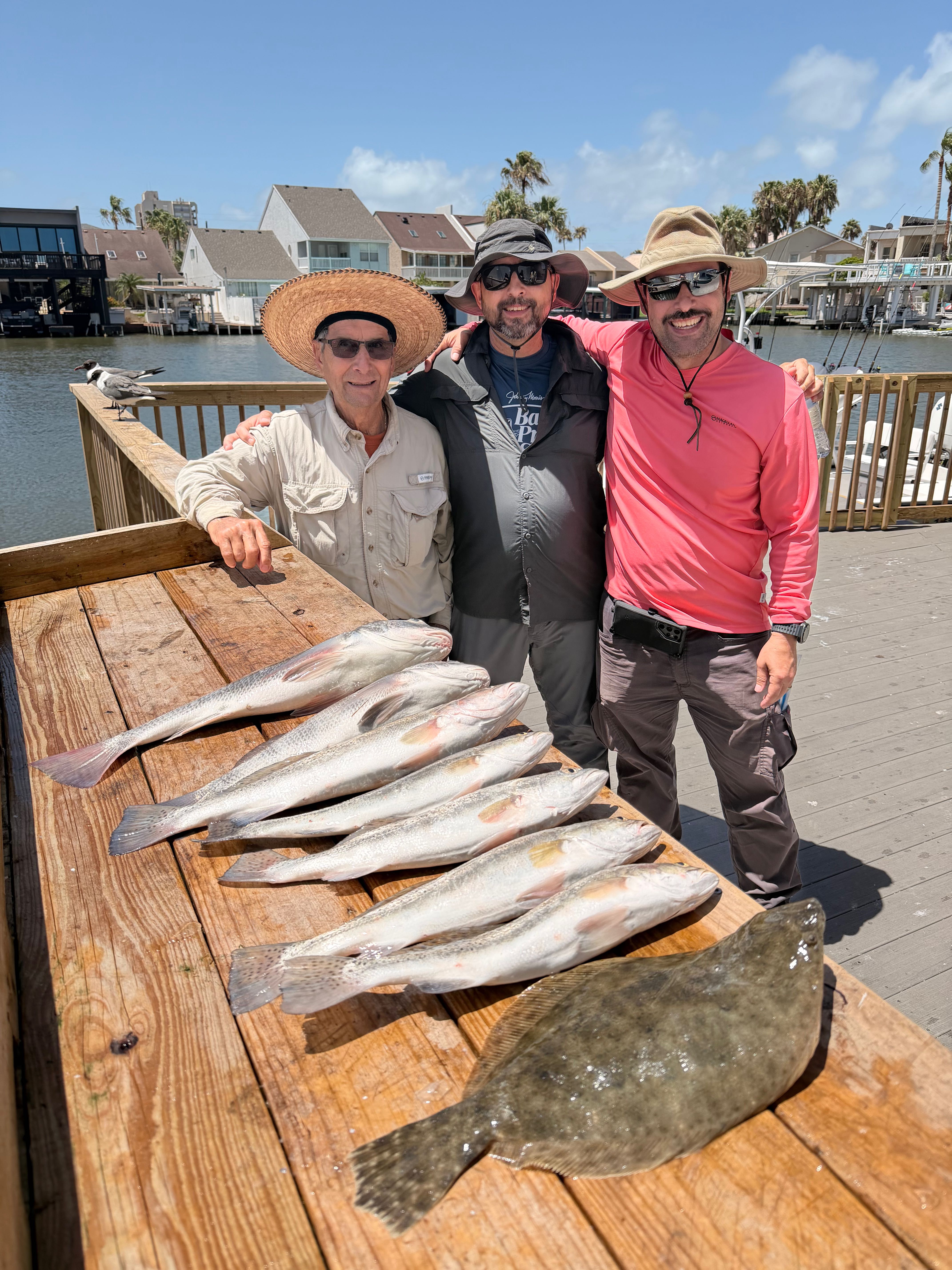 Successful fishing trip displaying Southern Flounder and Black Drum catch on South Padre Island TX dock