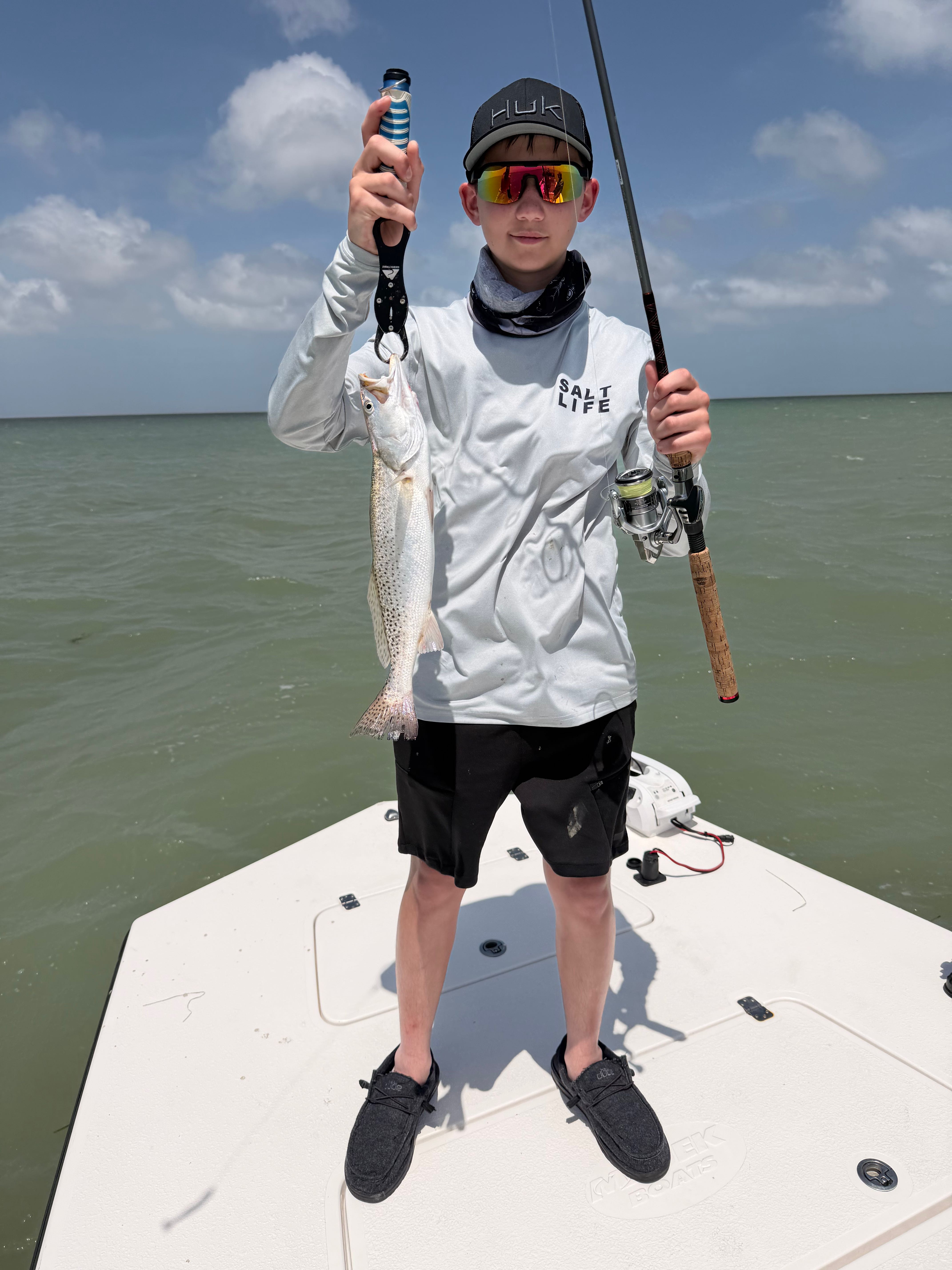 Speckled trout caught fishing on boat at South Padre Island TX during sunset