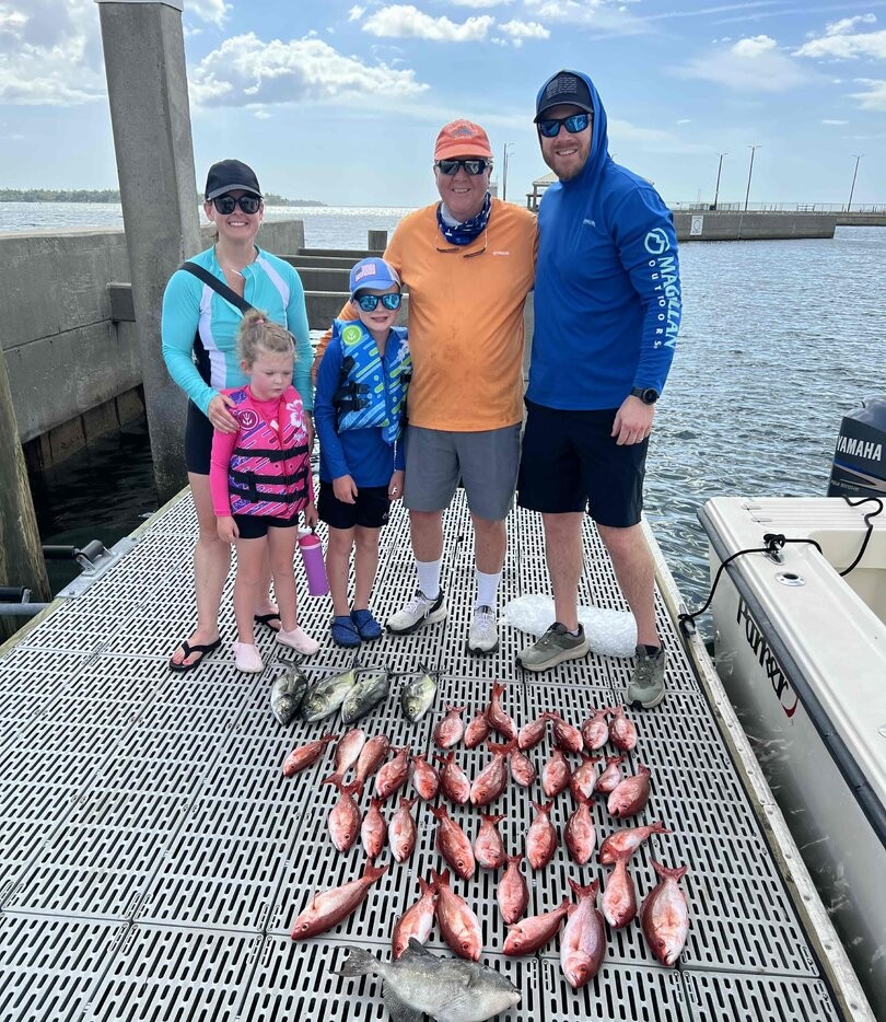 Fishing catch display on dock in Panama City FL showing red snapper and other fish species