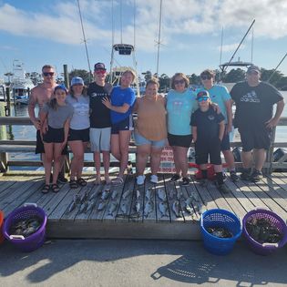 Group of 8 people fishing in Wanchese