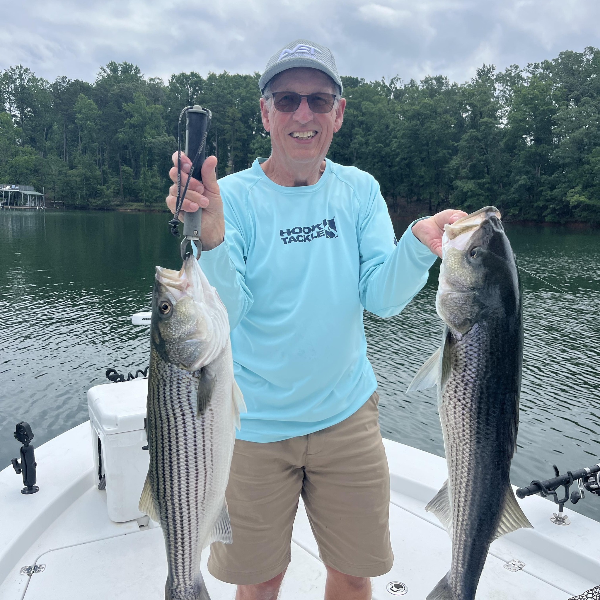 Two striped bass caught fishing on lake in Cumming GA
