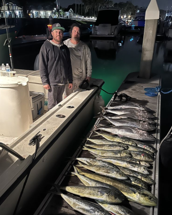 Two anglers catching big fish in California